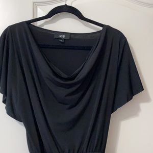 Flattering black dress. Versatile. Fun neckline